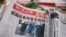 A copy of the Global Times newspaper featuring an image of U.S. President Joe Biden and Vice President Kamala Harris on its front page is seen at a news stand in Beijing, China, Jan. 21, 2021.