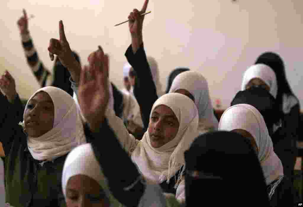 Yemeni girls attend school on the first International Day of the Girl Child, in Sanaa, Yemen, October 11, 2012. 
