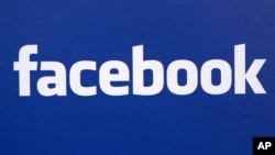 FILE - In this Nov. 6, 2007 file photo, the Facebook logo is displayed at a Facebook announcement in New York. 
