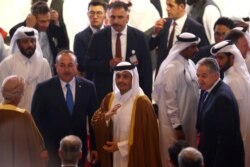 Qatari Deputy Prime Minister Sheikh Mohammed bin Abdulrahman al-Thani and Turkish Foreign Minister Mevlut Cavusoglu are among those attending a signing ceremony between members of Afghanistan's Taliban and the U.S. in Doha, Qatar, Feb. 29, 2020.
