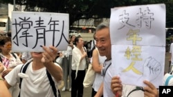 Elderly Hong Kong residents with posters that read "Support young people" during a march in Hong Kong on Wednesday, July 17, 2019. Some 2,000 Hong Kong senior citizens, including a popular actress, marched Wednesday in a show of support for youths…