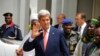 U.S. Secretary of State John Kerry waves after a visit to the sultan's palace in Sokoto, Nigeria, Aug. 23, 2016.