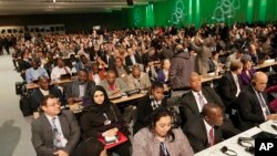 Delegates chat prior to the opening of the United Nations Climate Change Conference in Warsaw, Poland, Nov. 11, 2013.