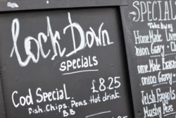 A lockdown special menu is pictured outside a fish and chip shop, as the Welsh Government is set to impose stricter lockdown measures to try to curb the spread of the coronavirus disease (COVID-19), in Llandudno, Britain, Oct. 19, 2020.