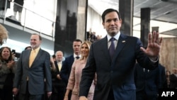 FILE - U.S. Secretary of State Marco Rubio and his wife Jeanette Rubio arrive to speak to employees upon arrival at the State Department in Washington, on Jan. 21, 2025.