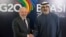 FILE - Brazilian President Luiz Inacio Lula da Silva, left, shakes hands with United Arab Emirates President Sheikh Mohamed bin Zayed Al Nahyan at the G20 Summit in Rio de Janeiro on Nov. 17, 2024.