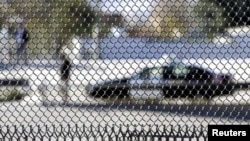 A patrol car is seen through a fence on the US-Mexican border in El Paso, Texas (file photo).