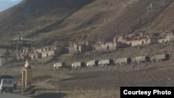 Chinese military trucks outside the Tarmo Monastery in Driru County, Tibetan Autonomous Region