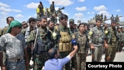 Soldiers participate in operation to liberate Raqqa, Syria, from Islamic State militants, May 24, 2016. (Photo courtesy of ANHA)
