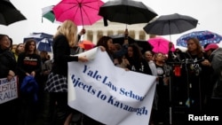 Yale Law students take part in a protest against U.S. Supreme Court nominee Brett Kavanaugh in front of the Supreme Court in Washington, U.S., Sept. 24, 2018. 
