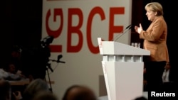 German Chancellor Angela Merkel (CDU) delivers a speech at a congress of the Industrial Mining, Chemistry, Energy Union (IG BCE) in Hanover, Oct. 16, 2013. 