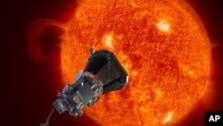 This image made available by the Johns Hopkins University Applied Physics Laboratory on Wednesday, May 31, 2017 depicts NASA's Solar Probe Plus spacecraft approaching the sun. 