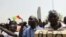 Supporters of Mali's junta participate in a demonstration against regional bloc ECOWAS at the international airport of Bamako, Mali, March 29, 2012. 