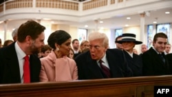 U.S. President-elect Donald Trump speaks with Vice President-elect JD Vance (L) and Usha Vance, second from left, during a church service at St. John's Episcopal Church, Lafayette Square in Washington, D.C., Jan. 20, 2025. Melania Trump and son Barron Trump are to the right.
