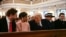 U.S. President-elect Donald Trump speaks with Vice President-elect JD Vance (L) and Usha Vance, second from left, during a church service at St. John's Episcopal Church, Lafayette Square in Washington, D.C., Jan. 20, 2025. Melania Trump and son Barron Trump are to the right.