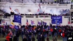 FILE - Protesters loyal to then-President Donald Trump storm the Capitol, Jan. 6, 2021. 