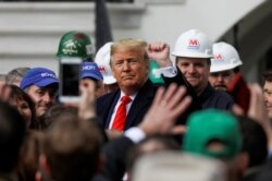 U.S. President Donald Trump acknowledges the crowd during a signing ceremony for the United States-Mexico-Canada Trade Agreement on the South Lawn of the White House in Washington, Jan. 29, 2020.