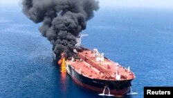 An oil tanker is seen after it was attacked at the Gulf of Oman, June 13, 2019.