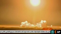 Video image from Iranian state TV shows the launch of a rocket carrying a Payam satellite at Imam Khomeini Space Center, a facility under the control of the country's Defense Ministry, in Semnan province, Iran, Jan. 15, 2019. 