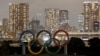 FILE - Olympic rings are installed on a floating platform ahead of the 2020 Olympic Games in Tokyo.