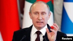 Russia's President Vladimir Putin speaks during a news conference, part of the Gas Exporting Countries Forum (GECF), at the Kremlin in Moscow, July 1, 2013. 