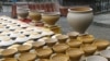 Pots drying in a potter's yard.