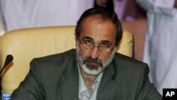Cleric Ahmad Maath al-Khatib was chosen in Doha voting to lead newly united opposition to oust Syrian's president, Bashar al-Assad, Nov. 11, 2012. (AP)