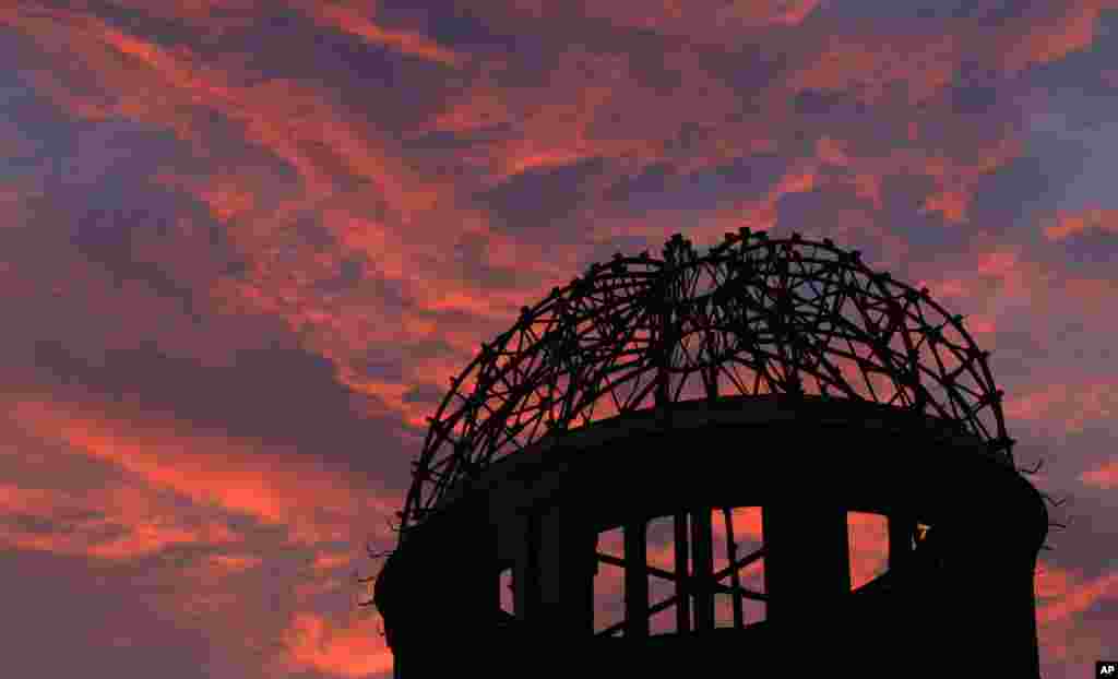 The Atomic Bomb Dome is silhouetted at sunset in Hiroshima, August 5, 2013.