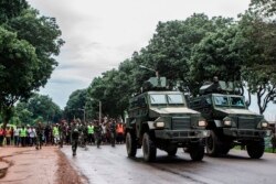 Malawi Defence Force members control a crowd in Lilongwe, Jan. 16, 2020, during protests against alleged attempts to bribe judges overseeing a legal challenge to the re-election last year of the country's president.