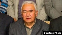 FILE - Nurmuhammad Tohti, sitting at a scholarly gathering in Urumqi, capital of Xinjiang, China. (Abduweli Ayup)
