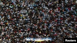 Crowds throng a religious festival in Nakhon Pathom province, Thailand, on March 23, 2024. Thailand's low birth rate could mean the population will shrink by half within 60 years.