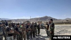 FILE - Afghan commandos arrive to reinforce security forces in Faizabad, capital of Badakhshan province, after the Taliban captured neighborhood districts of Badakhshan recently, July 4, 2021. 