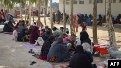 Afghan internally displaced families, who fled due to the ongoing battle between Taliban fighters and Afghan security forces, at a refugee camp in Kandahar on July 27, 2021. 