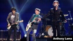 FILE - Ronnie Wood, left, Keith Richard, center, and Mick Jagger of the Rolling Stones perform in concert at the TD Garden arena in Boston, June 12, 2013. 
