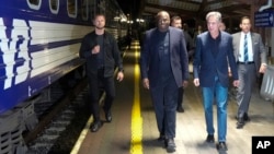 U.S. Secretary of State Antony Blinken, right and British Foreign Secretary David Lammy, walk along a platform to board a train at Przemysl railway station, in Poland, Sept. 11, 2024. 