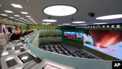 Russian officials oversee the test launch of the Avangard hypersonic glide vehicle from the Defense Ministry's control room in Moscow, Russia, Dec. 26, 2018.