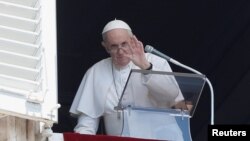 Pope Francis waves as he leaves after leading Angelus prayer from his window at the Vatican following intestinal surgery, at the Vatican, July 18, 2021. REUTERS/Remo Casilli