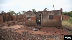 FILE - Deserted, razed villages line more than 100 kilometers of road south of Bossangoa.