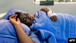 FILE - Zimbabwean activist Joana Mamombe lies hospitalized in Harare on May 15, 2020, after allegedly being abducted and beaten by police and eventually dumped along a road some distance from the capital.