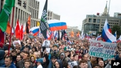 Tens of thousands of people rally in central Moscow, Aug. 10, 2019, for the third consecutive weekend to protest the exclusion of opposition and independent candidates from the Russian capital's city council ballot. 