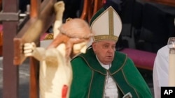 FILE - Pope Francis presides over a mass for the jubilee of the armed forces in St. Peter's Square at The Vatican, Feb. 9, 2025.