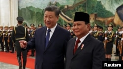 Chinese President Xi Jinping and Indonesian President Prabowo Subianto attend a welcome ceremony at the Great Hall of the People in Beijing, China, Nov. 9, 2024. 