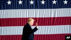President-elect Donald Trump arrives for a rally in a DOW Chemical Hanger at Baton Rouge Metropolitan Airport, Dec. 9, 2016, in Baton Rouge, Louisiana.