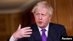 Britain's Prime Minister Boris Johnson speaks during a news conference at Downing Street in London, Britain Dec. 2, 2020. 