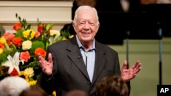 FILE - Former President Jimmy Carter teaches Sunday School class at the Maranatha Baptist Church in Plains, Ga., Aug. 23, 2015. The Fox theater in Atlanta recently hosted dozens of musical acts and thousands of guests for a concert celebrating Carter's 100th birthday.