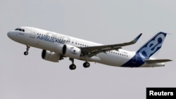 FILE - Normal rate of ascent for commercial jets like the Airbus A320 pictured is 300 to 600 meters per minute, an Indonesian official says; AirAsia Flight QZ8501, which crashed Dec. 28, was climbing about 1,800 meters per minute.