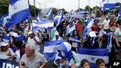 FILE - Anti-government marchers demand the resignation of President Daniel Ortega and the release of political prisoners in Managua, Nicaragua, July 22, 2018. The government said it released 636 prisoners Tuesday.