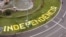 FILE - The word 'Independencia' (independence) is seen on a roundabout before a rally dedicated to Catalonia's National Day, in Barcelona, Spain, Sept. 11, 2019. 