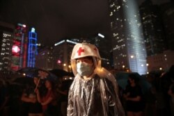A member of Hong Kong's medical sector attends a rally to support the anti-extradition bill protest in Hong Kong, Aug. 2, 2019.