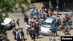 Sudanese demonstrators chant slogans during a protest demanding that Sudanese President Omar al-Bashir step down in Khartoum, April 6, 2019.